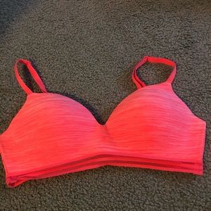 peach colored VS sports bra